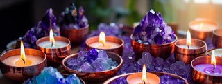 Soulful Candles surrounded by blue crystals 